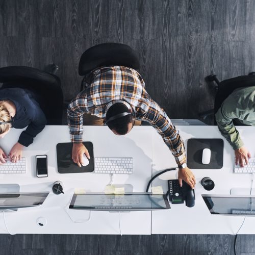 High angle shot of a group of sales people working in an office
